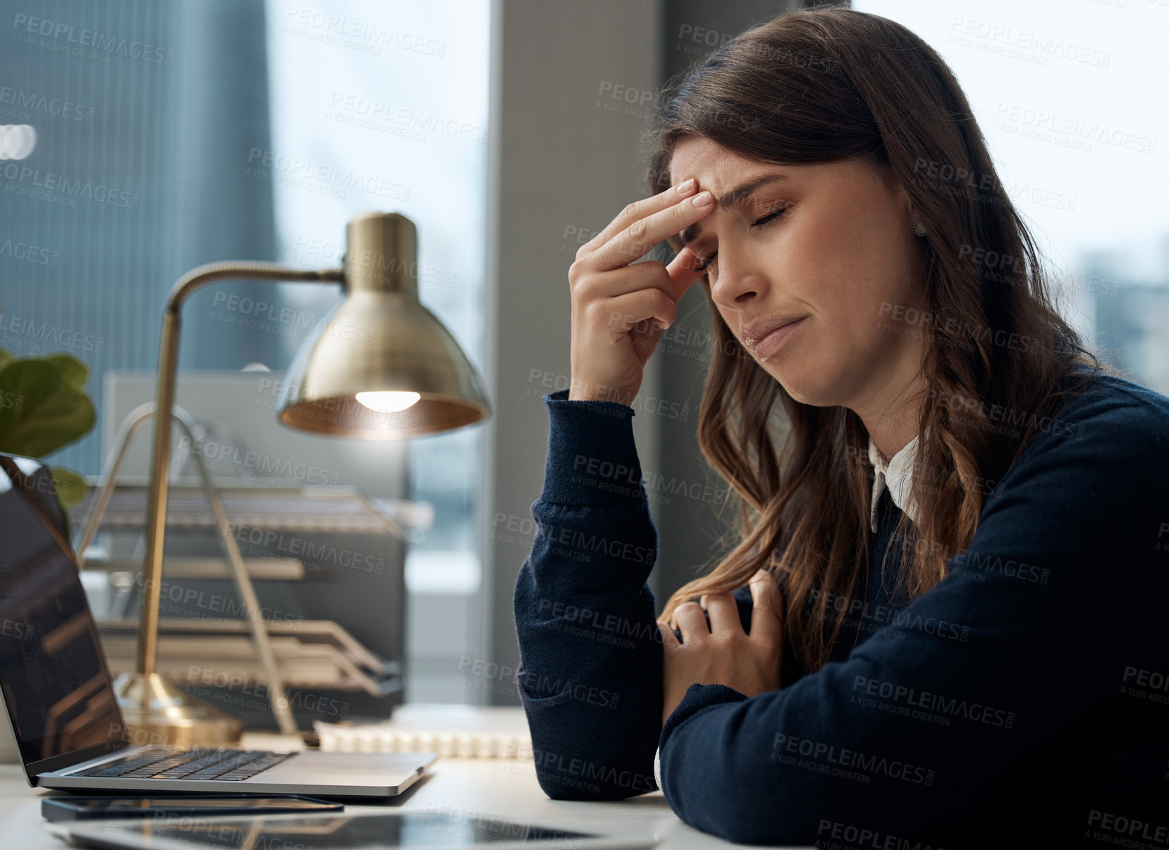 Buy stock photo Woman, tired and headache by laptop in office with pressure for audit deadline, anxiety and migraine. Finance, desk and accountant with tension by tech for burnout, problem and exhausted at work