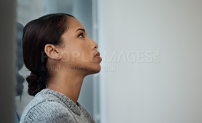 Buy stock photo Shot of a young businesswoman  taking a break and leaning against a window