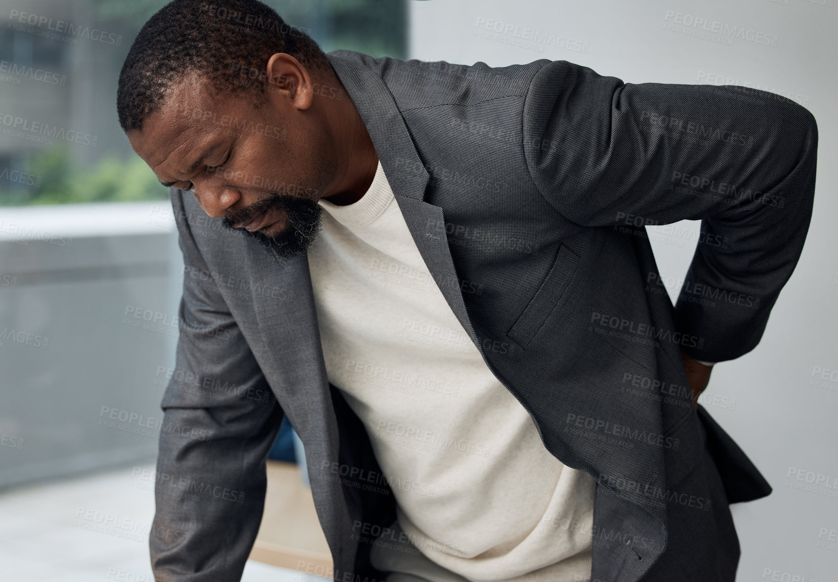 Buy stock photo Stress, burnout and black man in office with back pain, accident or injury for career fatigue. Overworked, body ache and African male lawyer with spine muscle sprain or inflammation in workplace.