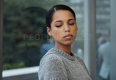 Buy stock photo Shot of a young businesswoman  taking a break and leaning against a window