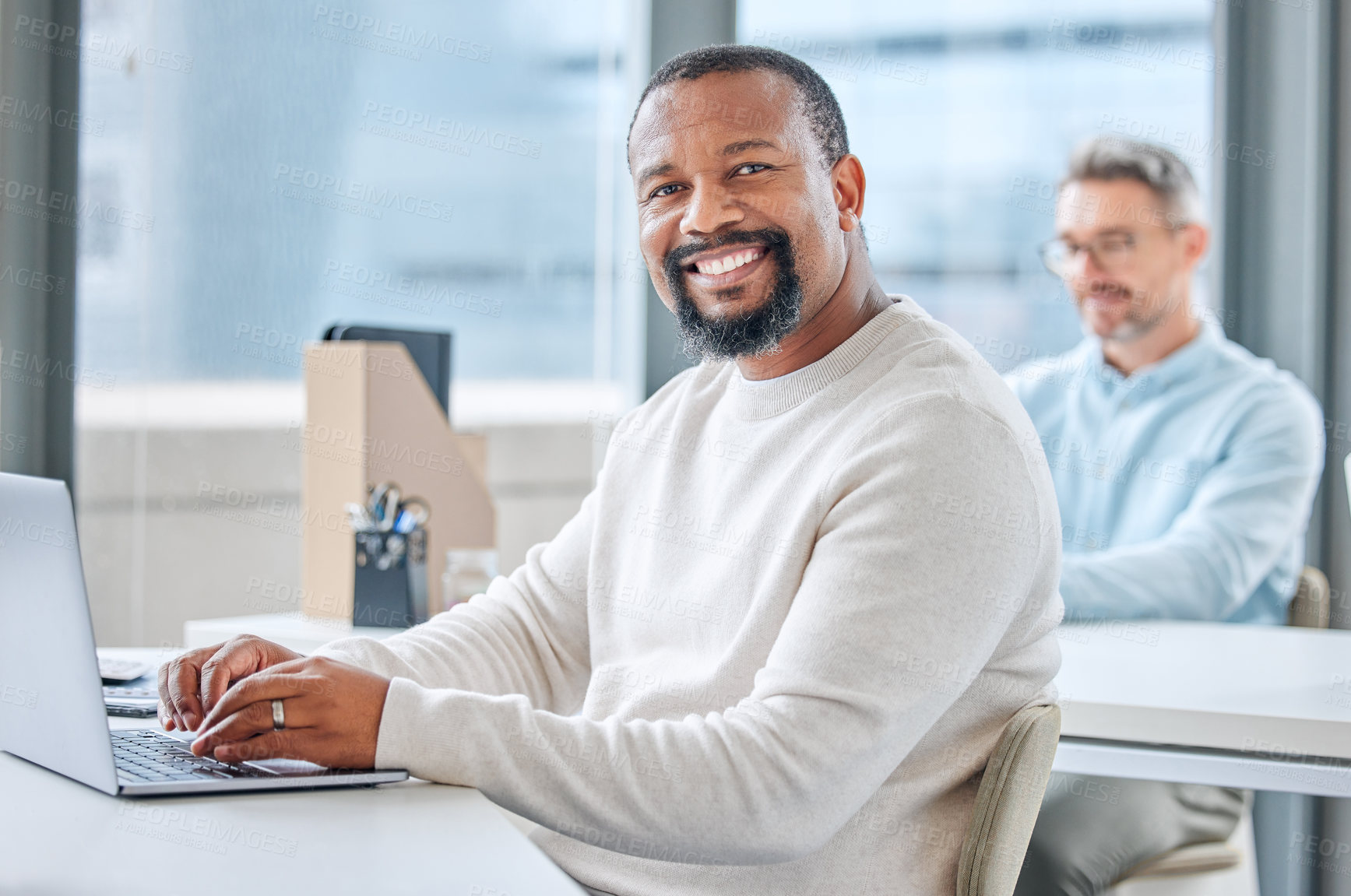 Buy stock photo Coworking, office and portrait of black man with laptop writing email, notes or productivity on project. Happy, businessman and hard work in creative workplace with journalist typing article at desk