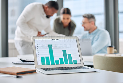 Buy stock photo Shot of a laptop with graphs on display in an office with businesspeople working in the background