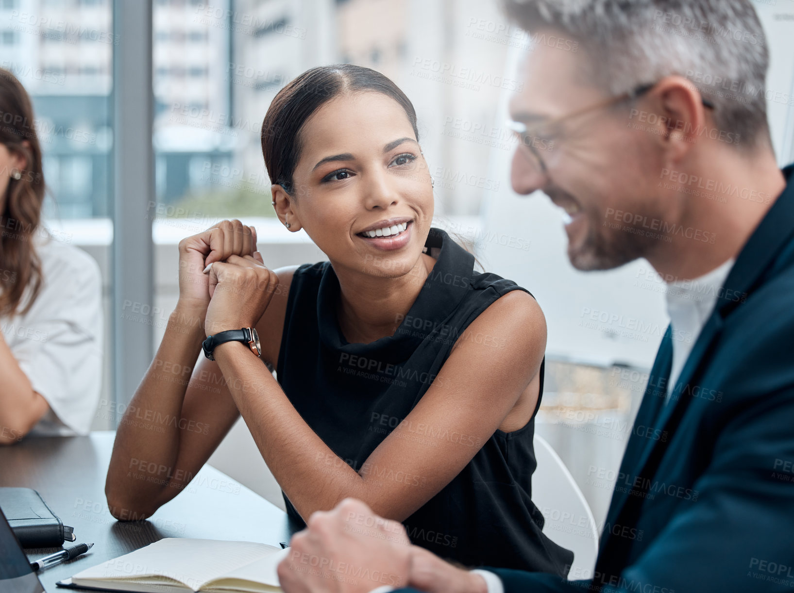 Buy stock photo Cropped shot of a group of corporate business colleagues having a meeting around the table in the boardroom