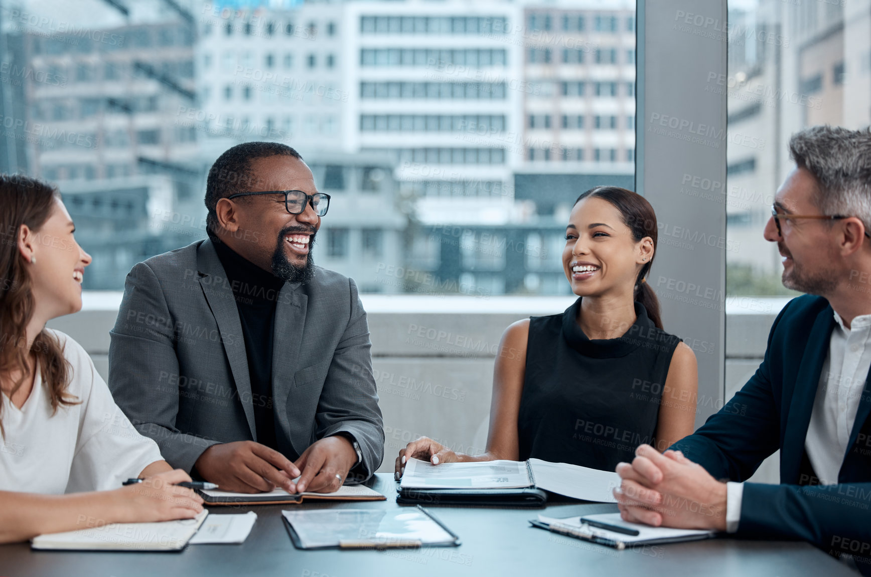 Buy stock photo Cropped shot of a group of corporate business colleagues having a meeting around the table in the boardroom