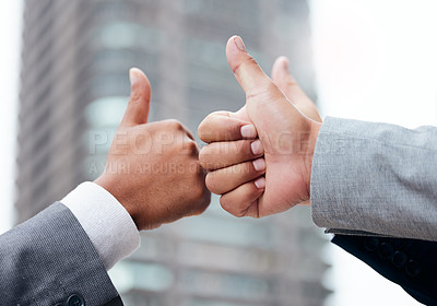 Buy stock photo Shot of a group of young businesspeople giving each other a thumbs up at the office