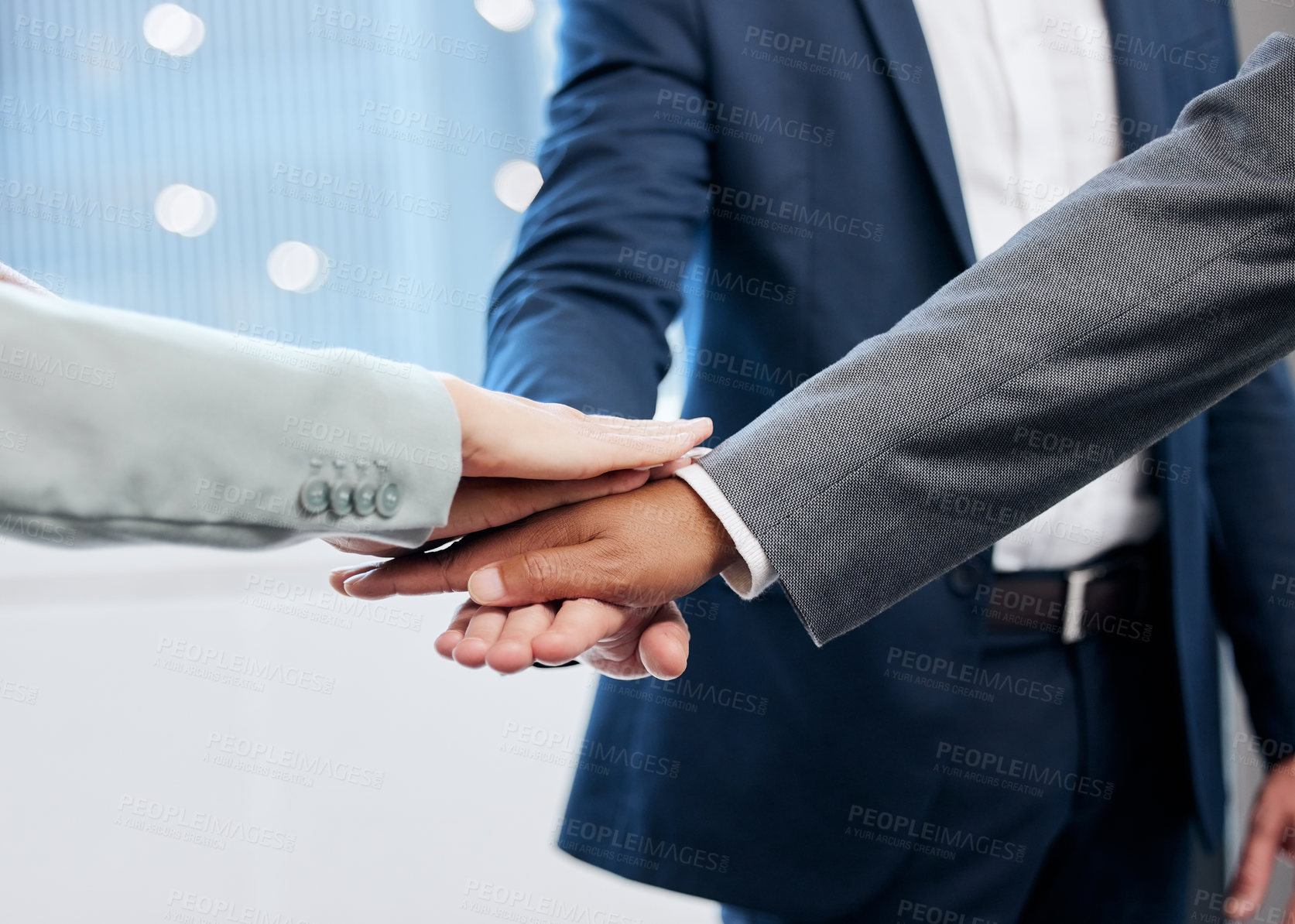 Buy stock photo Shot of a group of businesspeople joining their hands in solidarity