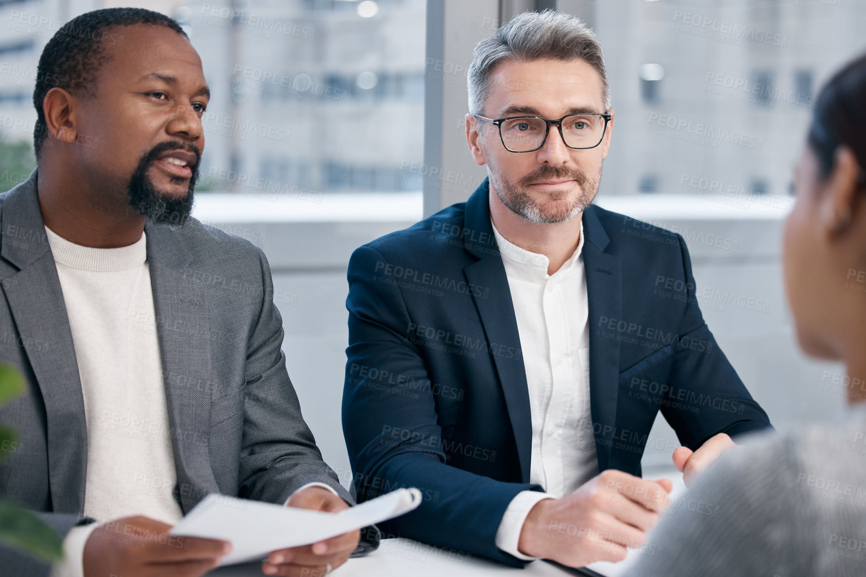 Buy stock photo Shot of a group of businesspeople having a meeting in an office