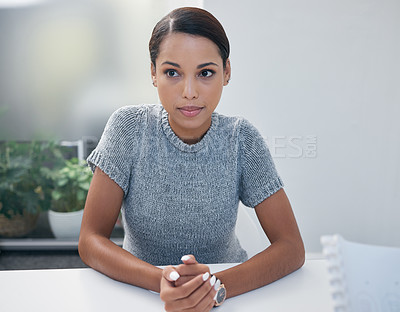Buy stock photo Shot of a young businesswoman sitting in on a meeting in an office