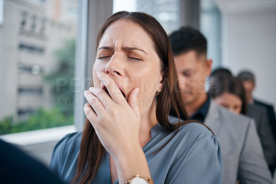 Buy stock photo Shot of a young businesswoman yawning in a waiting room