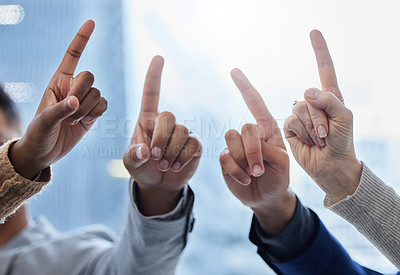 Buy stock photo Shot of a group of businesspeople with their fingers raised