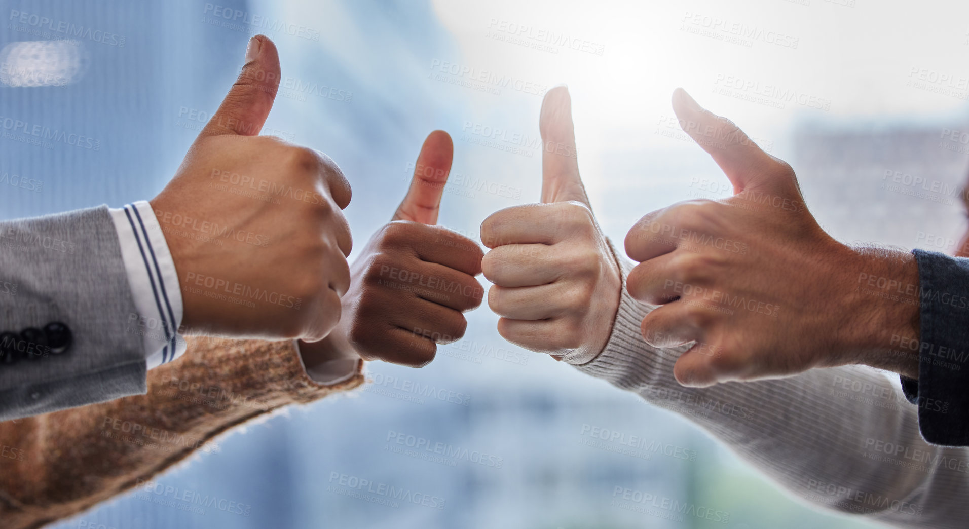 Buy stock photo Shot of a group of people giving the thumbs up