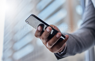 Buy stock photo Shot of a businessperson using a smartphone
