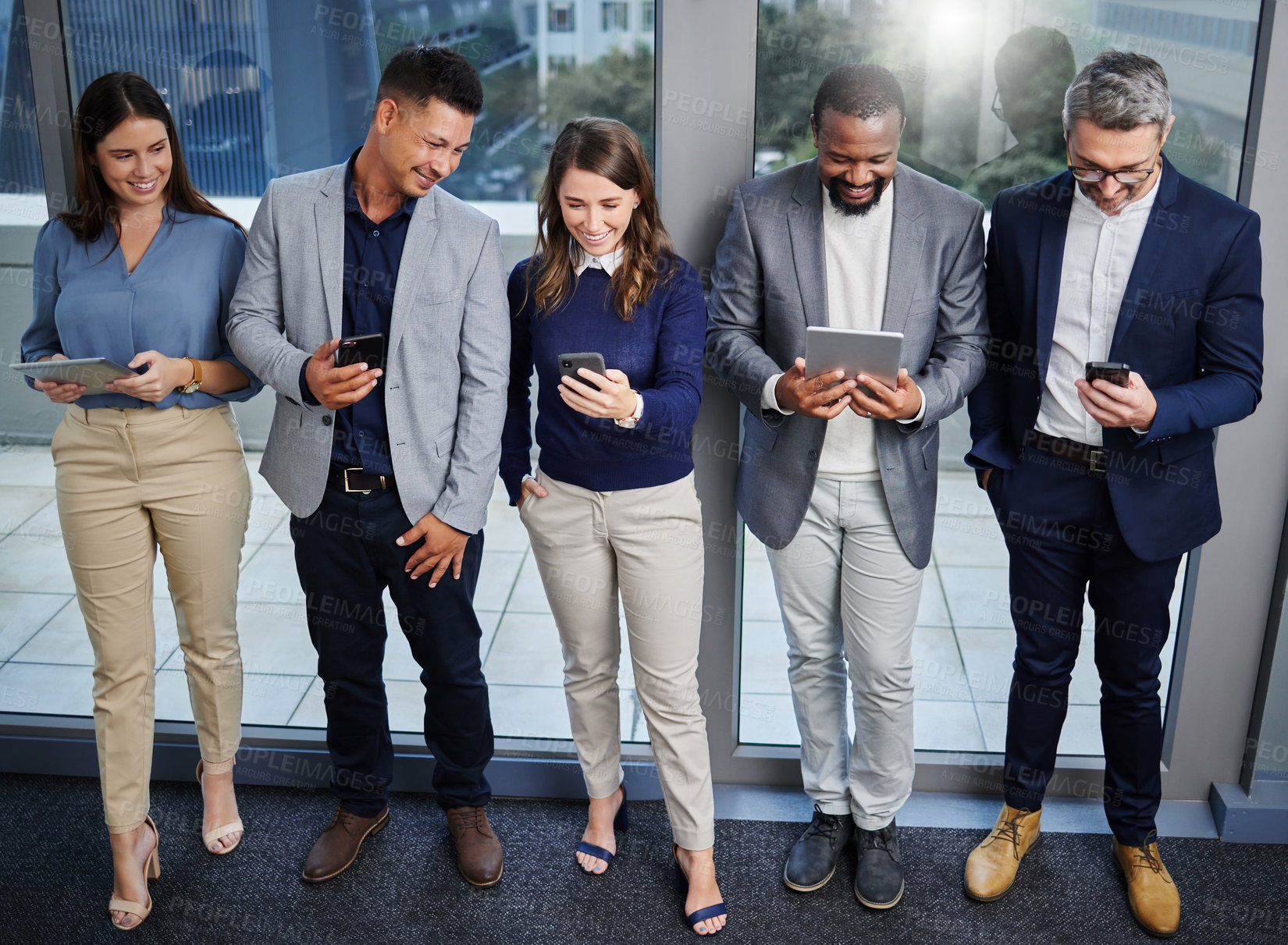 Buy stock photo Business people, smartphone and tablet in office waiting room for communication, job interview or social media. Technology, team or group in for recruitment, collaboration and support or planning