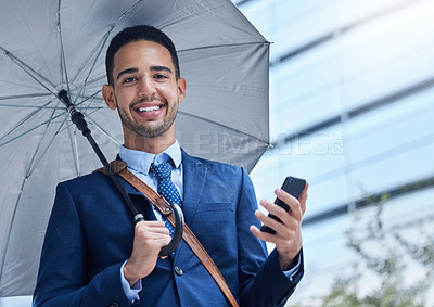 Buy stock photo Businessman, mobile and umbrella with communication in city for justice, advocate for legal with tech. Male lawyer, rain or parasol for safety in urban with phone, attorney in New York with smile