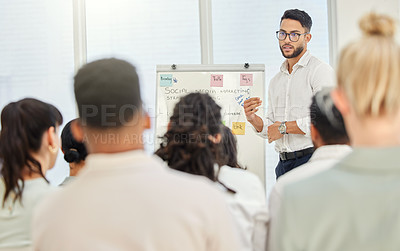 Buy stock photo Cropped shot of a handsome young businessman giving a presentation in the conference hall