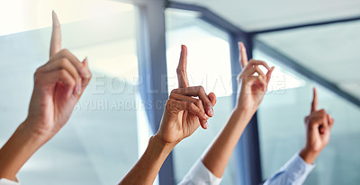 Buy stock photo Cropped shot of four unrecognizable businesspeople sitting with their hands raised in the office