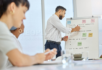 Buy stock photo Cropped shot of a handsome young businessman giving a presentation in the boardroom