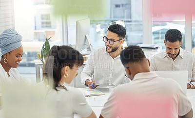 Buy stock photo Cropped shot of a group of young diverse businesspeople having a meeting in the boardroom