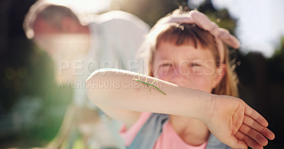 Buy stock photo Shot of a young girl discovering bugs in her backyard