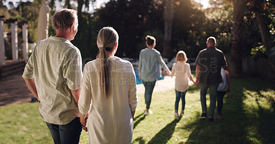 Buy stock photo Big family, love and walking together in garden for sunset, bonding and peace in nature. Grandmother, grandfather and kids in park or backyard for happiness, view and satisfied with life or journey