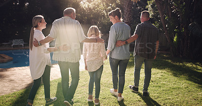 Buy stock photo Back, hug and a family in a backyard for sunshine, summer and conversation. Happy, love and parents, grandparents and a child in a home garden with affection, walking and speaking during a visit