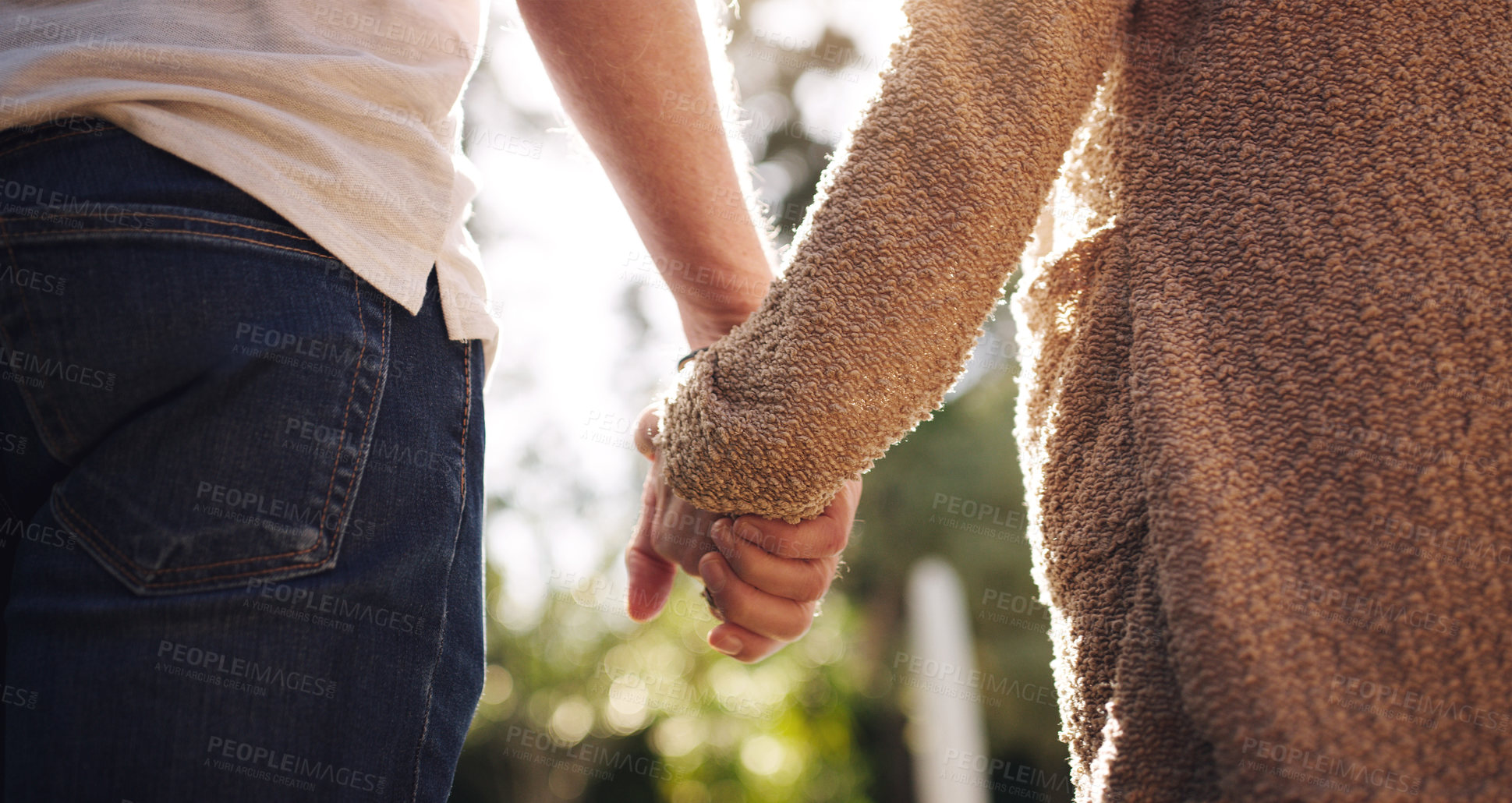 Buy stock photo Couple, love and holding hands with back view for relationship, summer and happy date in park. Man, woman and romantic walk together in forest with trust or care for commitment, nature and freedom