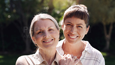 Buy stock photo Shot of a mother and daughter embracing outside