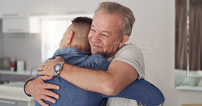 Buy stock photo Shot of a father and son hugging