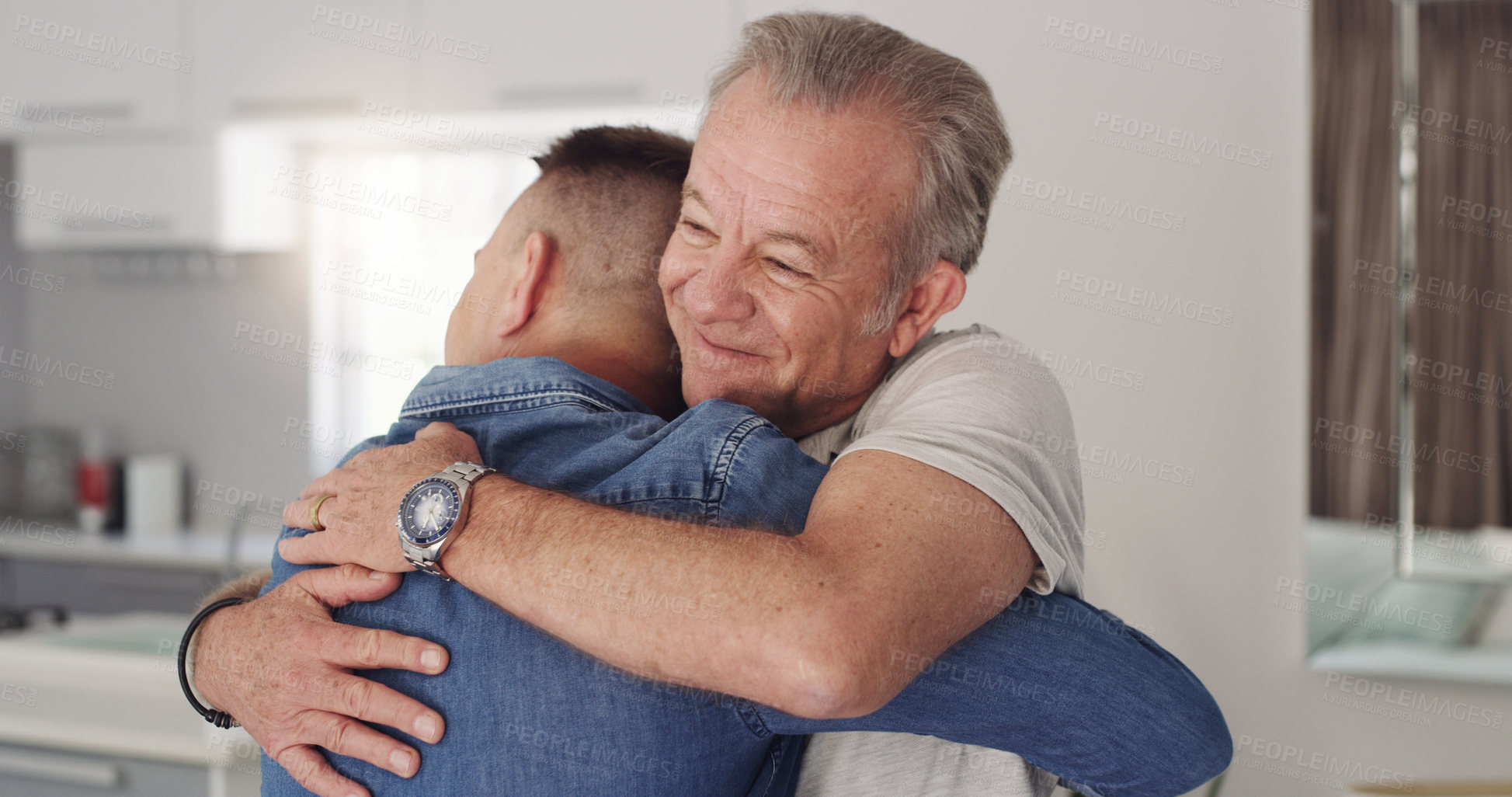 Buy stock photo Shot of a father and son hugging