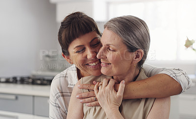 Buy stock photo Shot of s mother and daughter hugging one another
