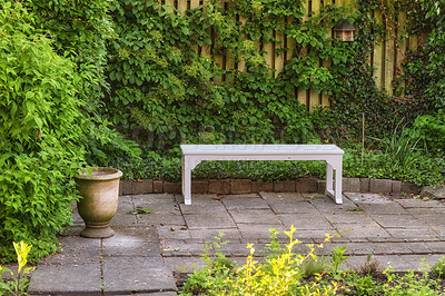 Buy stock photo Private chair in green garden in the beautiful outdoors. A place with green nature views outside. Resting area for relaxation and isolated seating area surrounded by natural life.