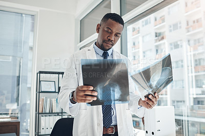 Buy stock photo Healthcare, black man and surgeon with skull scan for diagnosis, check results or ideas in hospital. Neurology, review and doctor with xray for assessment, decision or planning treatment on injury