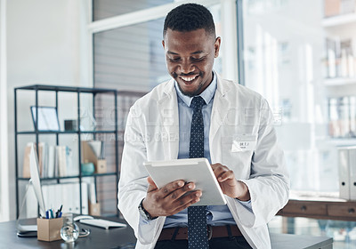 Buy stock photo Medical, doctor and tablet for work, smile and telehealth for clinic, serious and online for healthcare. Workplace, hospital and internet and technology for black man, science and research of staff