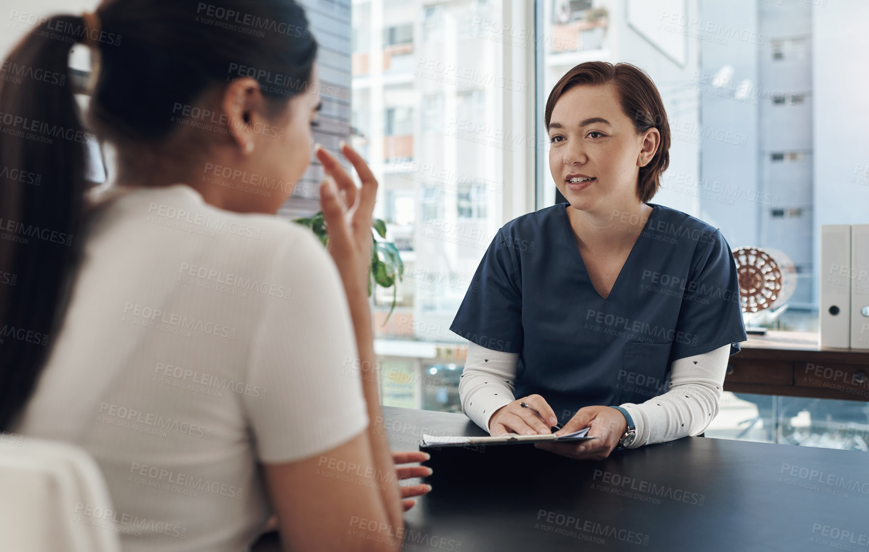 Buy stock photo Nurse, woman and clipboard or patient for healthcare with discussion, medical history and diagnosis in clinic office. Consultation, expert and person with questions, treatment and checkup with advice