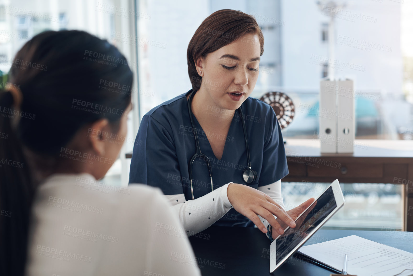 Buy stock photo Healthcare, female nurse and tablet for consultation with patient, results and digital update. Hospital, woman and medical employee with technology for information, prescription and diagnosis