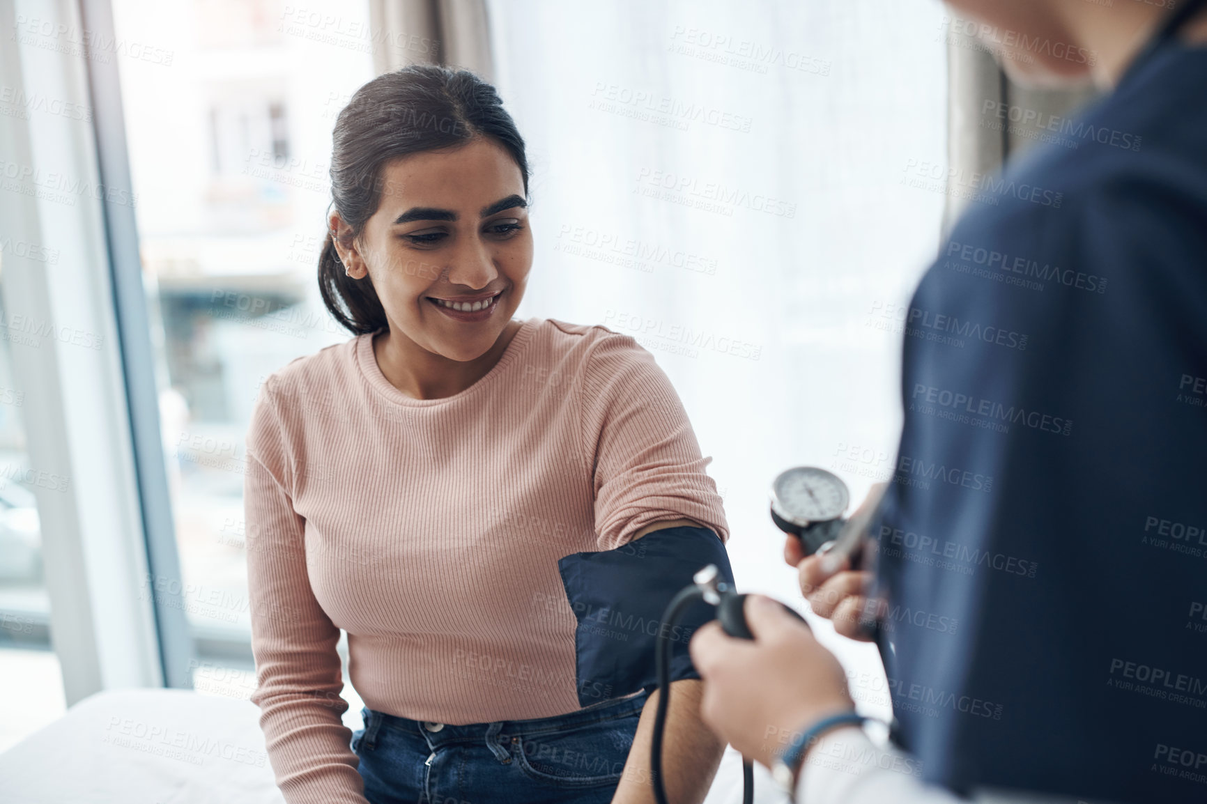 Buy stock photo Blood pressure, woman and health check with a smile at a clinic and healthcare hospital with doctor. Monitor, checking and nurse with young female patient at a wellness and medical consultation 