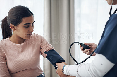 Buy stock photo Blood pressure, woman and health test with support at a clinic and healthcare hospital with doctor. Monitor, checking and nurse with young female patient at a wellness and medical consultation 