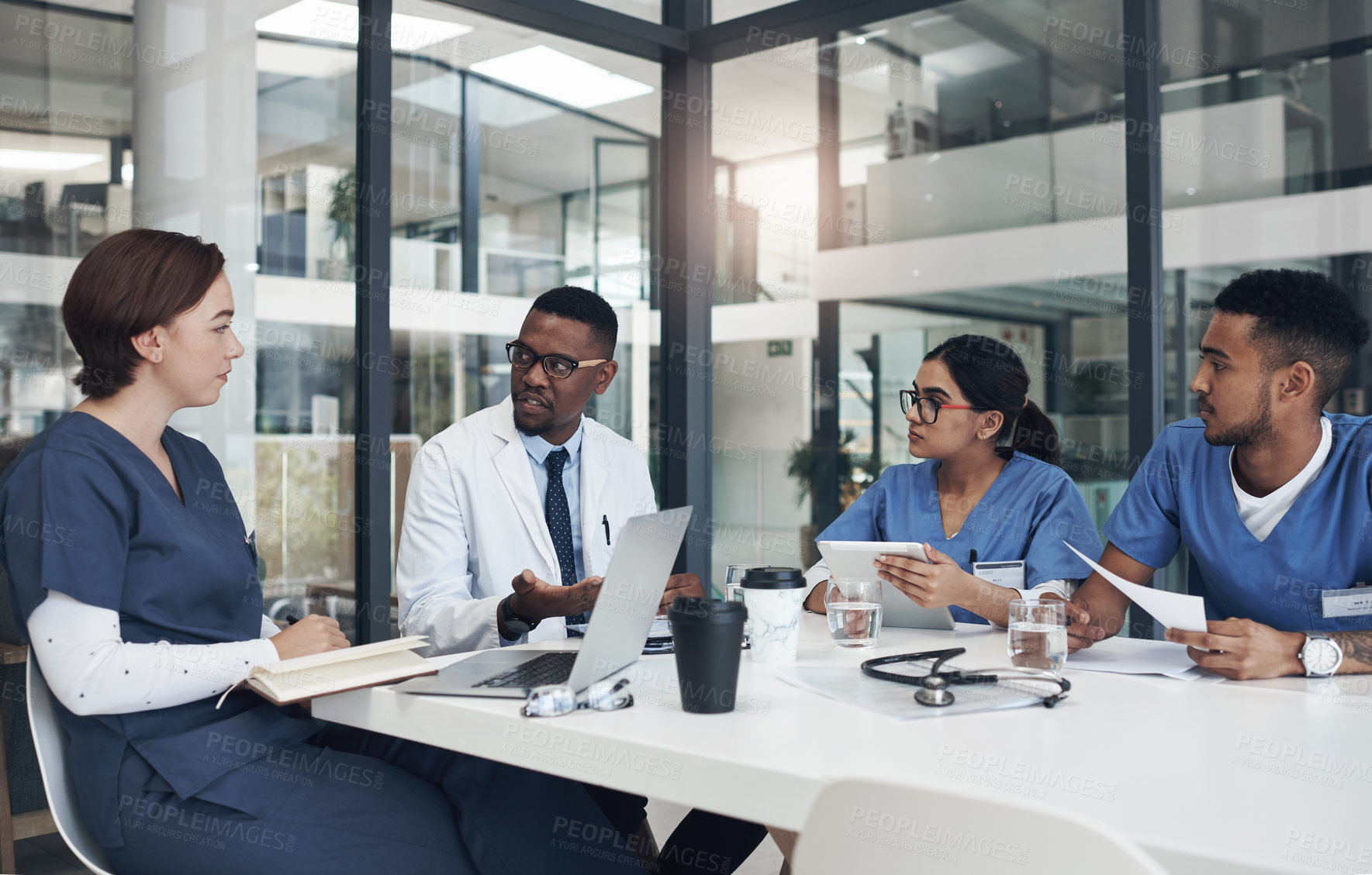 Buy stock photo Meeting, laptop and team of doctors in office for medical treatment, diagnosis or surgery planning in clinic. Discussion, computer and surgeon with group of healthcare interns learning in hospital.