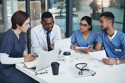 Buy stock photo Doctors, teamwork and planning for healthcare in office with laptop, documents and research. Nurses, collaboration and group diversity in boardroom brainstorming strategy for telemedicine development