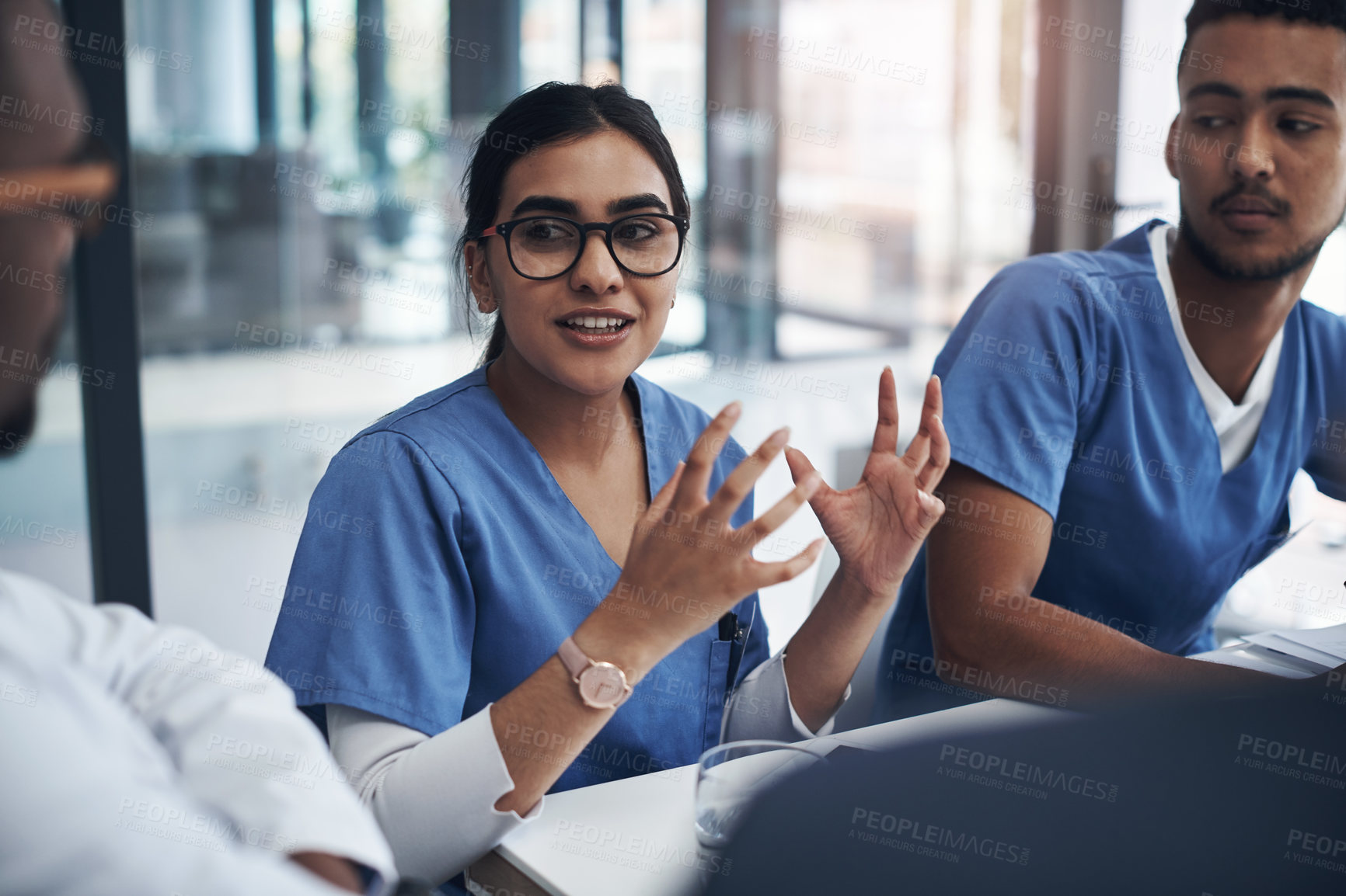 Buy stock photo Healthcare, medical team in a meeting and talking in conference room. Medicine discussion or communication, teamwork or collaboration and doctors or nurses speaking about confidential patient data