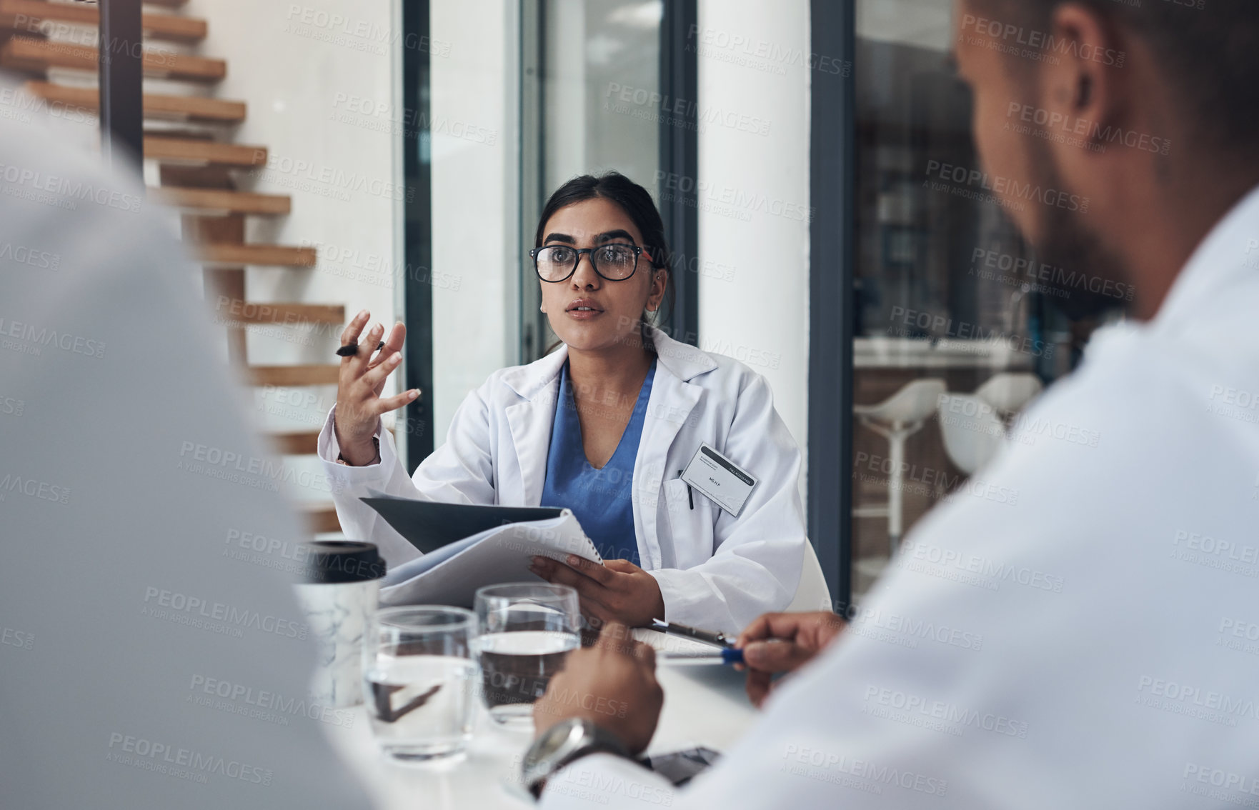 Buy stock photo Thinking, medical people and woman talking in meeting for planning, treatment or opinion of diagnosis. Healthcare, collaboration and doctor with document for info, communication and idea for illness