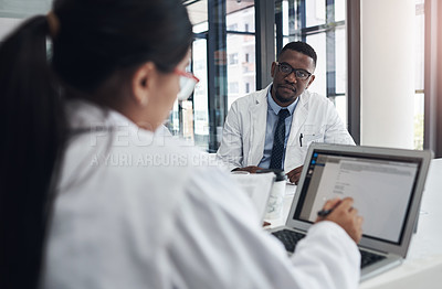 Buy stock photo Doctors, meeting and research together on laptop for health, medicine or healthcare innovation. Tech, surgeons or physicians talking in office for consulting, collaboration or teamwork in hospital