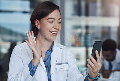 Buy stock photo Video call, smartphone and doctor wave for communication in healthcare, social media or telehealth. Hospital, happy woman and hello with mobile for conversation, networking and connect with tech