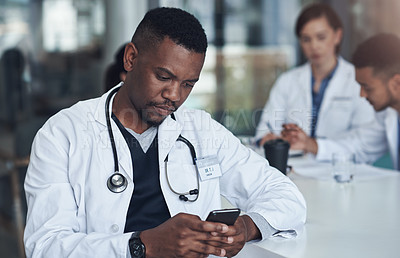 Buy stock photo Man, phone and doctor with typing in hospital for telehealth, healthcare research or service. Medical professional, clinic and person with smartphone for digital consulting, online network or website