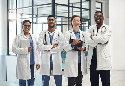 Buy stock photo Doctors, smile and portrait in hospital standing with arms crossed for health care, wellness and solidarity. Clinic, surgeons or physicians together for medical advice, teamwork or collaboration