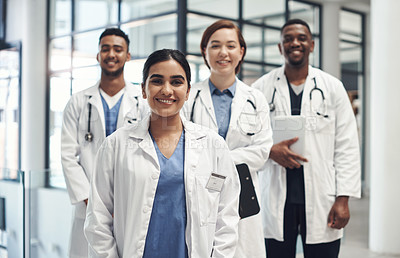 Buy stock photo Doctors, smile and portrait in hospital standing together for healthcare, wellness and solidarity. Clinic, surgeons or physicians in group for medical advice, teamwork or collaboration in medicine