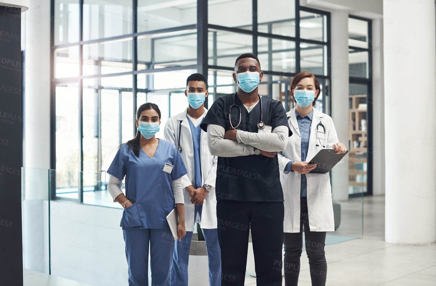 Buy stock photo Doctors, man and arms crossed with mask, team and portrait with diversity for medical career in hospital. Surgeon group, people and women with collaboration, wellness and ppe for healthcare services