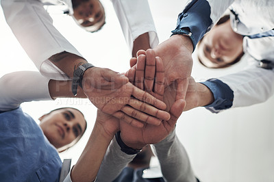 Buy stock photo Low angle, hands and stack with doctors, healthcare and cooperation with teamwork, support and trust. Below, medical and professional with group, collaboration and schedule with goals, win and target