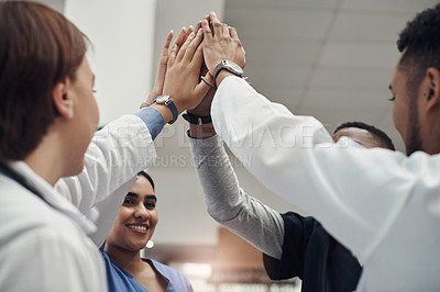 Buy stock photo Happy, teamwork and doctor with high five in hospital for collaboration, support and motivation. Medical people, diversity and group of hands with celebration for healthcare, success and partnership