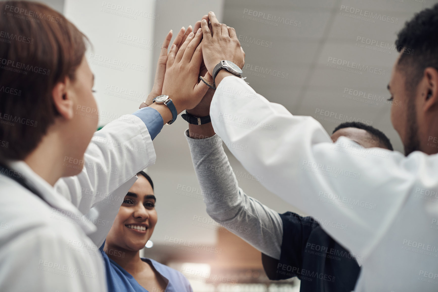 Buy stock photo Happy, teamwork and doctor with high five in hospital for collaboration, support and motivation. Medical people, diversity and group of hands with celebration for healthcare, success and partnership